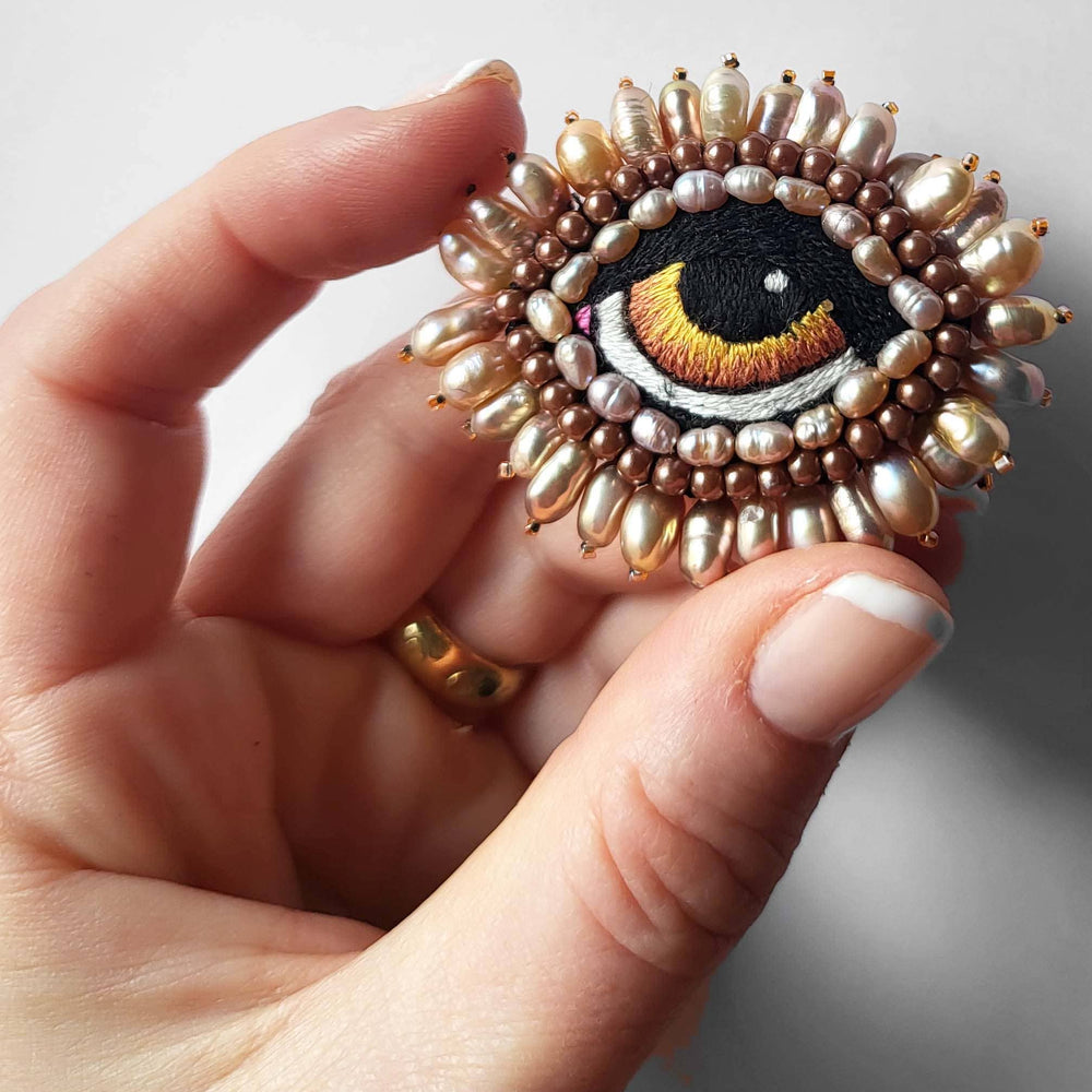 BAROQUE EYE BROOCH WITH FRESHWATER PEARLS